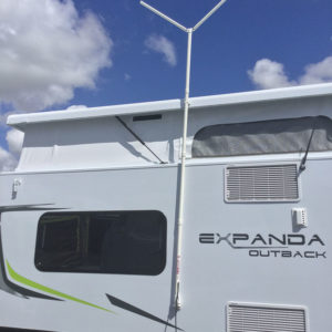 Fold Away TV aerial for caravan mounted on the side of a modern caravan, ready for optimal reception.